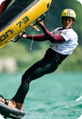 Athlete Wingfoiling across the water during a competition or training session.